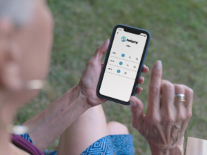 hot-spring-connected-spa-jets-on-phone-older-woman-1200x900